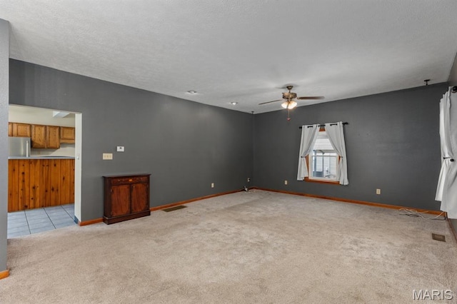 311 S Edwardsville St, Staunton, IL 62088 - unfurnished living room featuring light carpet and ceiling fan