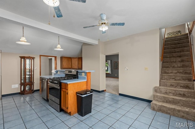 311 S Edwardsville St, Staunton, IL 62088 - kitchen featuring stainless steel appliances, ceiling fan, brown cabinetry, light tile patterned floors, and light countertops