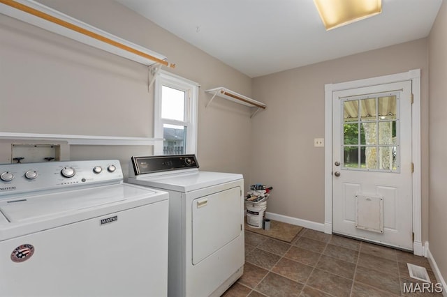 311 S Edwardsville St, Staunton, IL 62088 - laundry area with separate washer and dryer and baseboards
