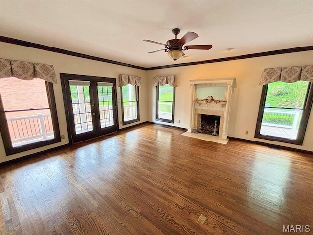 512 Overlook Terrace Ct, Eureka, MO 63025 - unfurnished living room with wood finished floors, healthy amount of natural light, a high end fireplace, crown molding, and french doors
