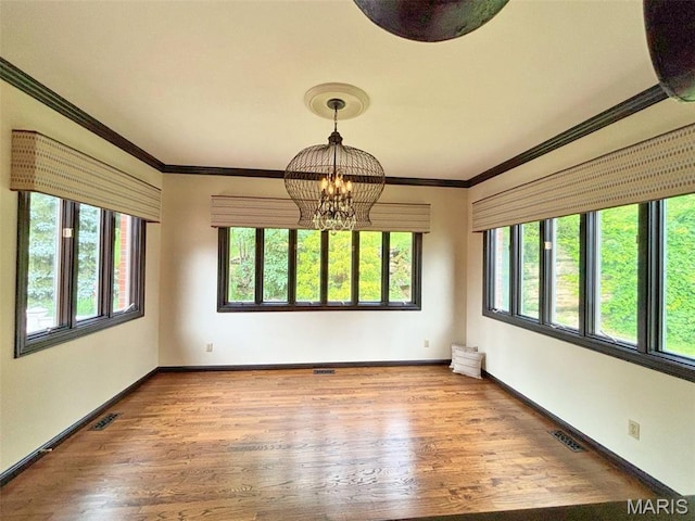 512 Overlook Terrace Ct, Eureka, MO 63025 - spare room featuring a chandelier, wood finished floors, and crown molding