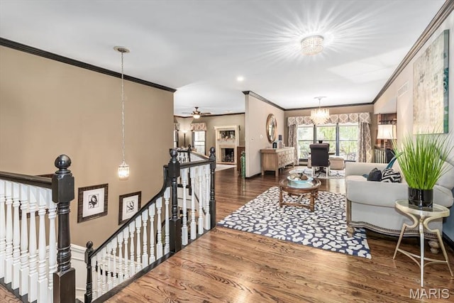 512 Overlook Terrace Ct, Eureka, MO 63025 - living area with crown molding, a chandelier, and wood finished floors