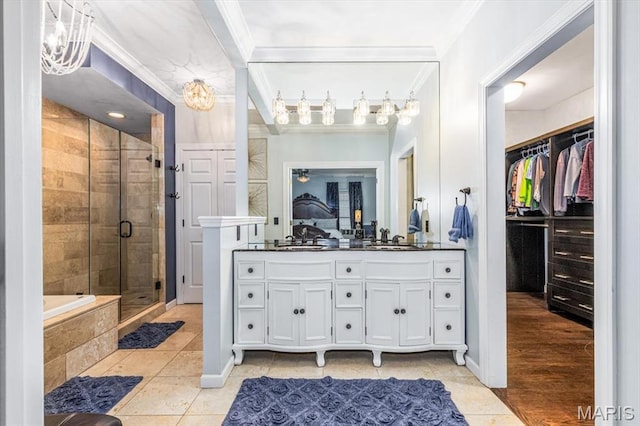512 Overlook Terrace Ct, Eureka, MO 63025 - bathroom featuring crown molding, vanity, a shower stall, a spacious closet, and tile patterned floors