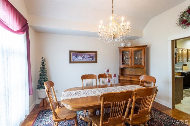 103 Woodland Ln, Saint Robert, MO 65584 - dining space featuring a chandelier and vaulted ceiling