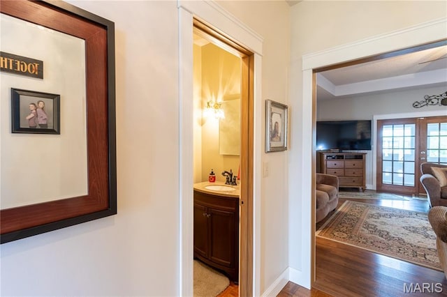 103 Woodland Ln, Saint Robert, MO 65584 - hallway with wood finished floors and french doors