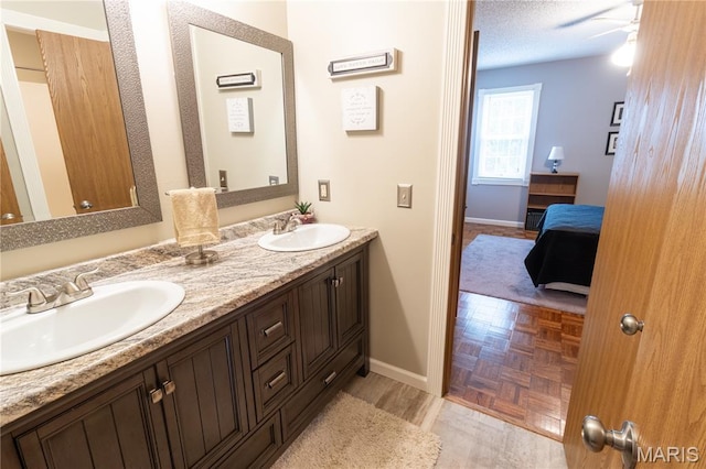 103 Woodland Ln, Saint Robert, MO 65584 - ensuite bathroom featuring double vanity and ceiling fan