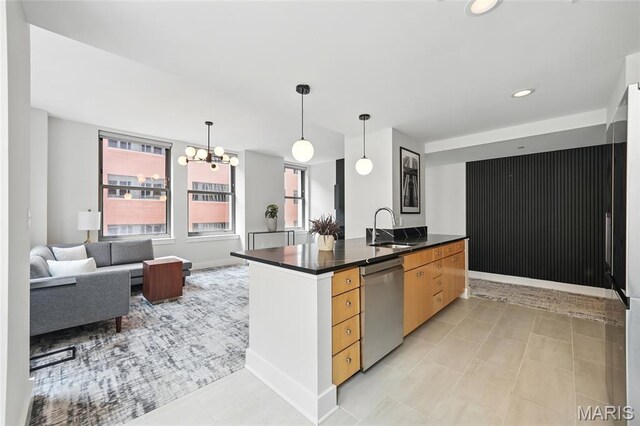 314 N Broadway Unit 806, Saint Louis, MO 63102 - kitchen featuring dishwasher, a sink, dark countertops, a chandelier, and baseboards