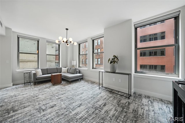314 N Broadway Unit 806, Saint Louis, MO 63102 - living area with a chandelier, carpet flooring, and baseboards