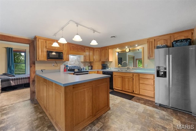 19185 Highway Hwy, Arcadia, MO 63621 - kitchen with black appliances, a sink, light countertops, a peninsula, and decorative light fixtures
