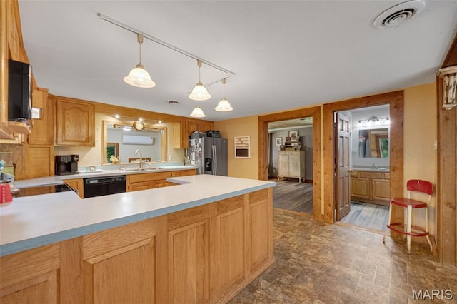 19185 Highway Hwy, Arcadia, MO 63621 - kitchen with stainless steel fridge, black dishwasher, light countertops, range, and a sink