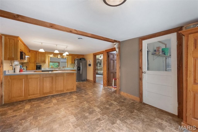 19185 Highway Hwy, Arcadia, MO 63621 - kitchen with stainless steel refrigerator with ice dispenser, light countertops, a peninsula, baseboards, and hanging light fixtures