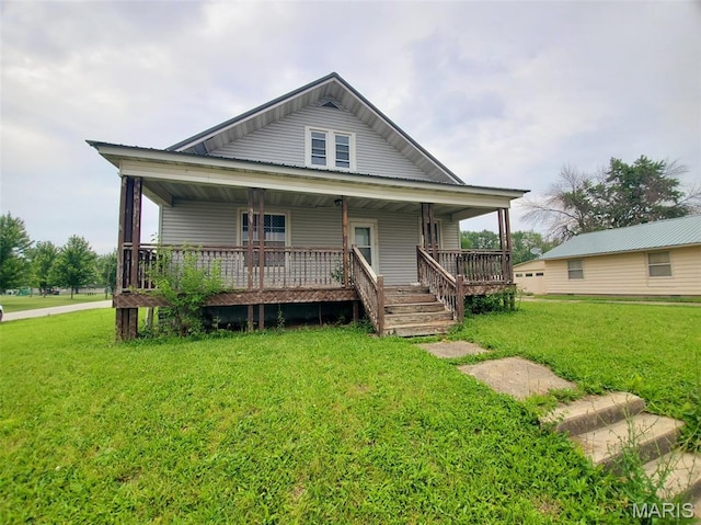 201 E Main St, Lewistown, MO 63452 - view of front of home featuring a front yard and covered porch