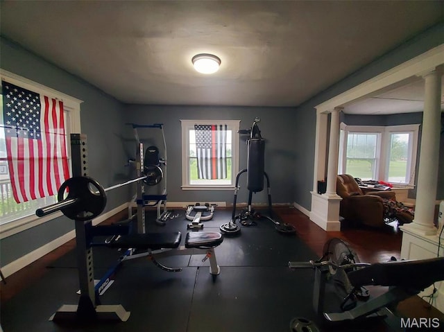 201 E Main St, Lewistown, MO 63452 - exercise area featuring decorative columns, plenty of natural light, and baseboards