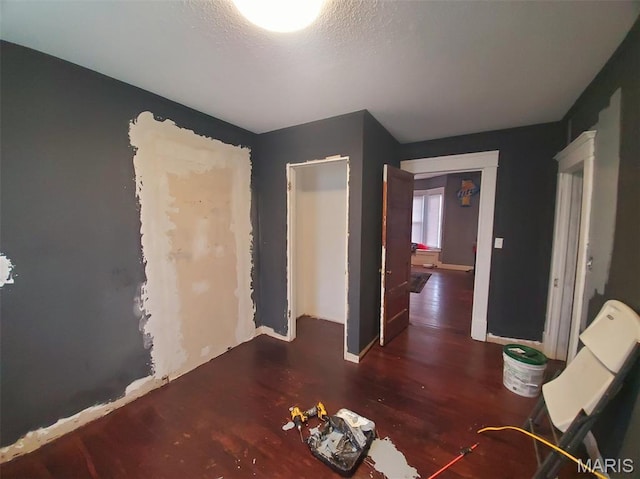 201 E Main St, Lewistown, MO 63452 - bedroom with wood finished floors, baseboards, and a textured ceiling