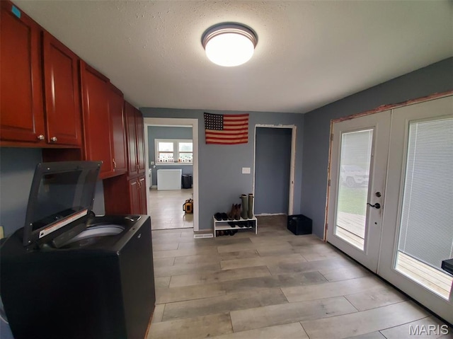 201 E Main St, Lewistown, MO 63452 - kitchen featuring french doors, reddish brown cabinets, and light wood-type flooring