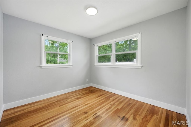 1005 Edgehill Dr, Ferguson, MO 63135 - empty room with baseboards and light wood-style flooring