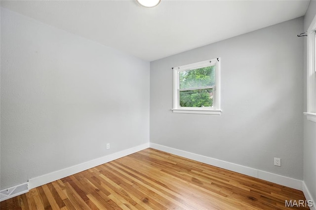 1005 Edgehill Dr, Ferguson, MO 63135 - spare room featuring wood finished floors