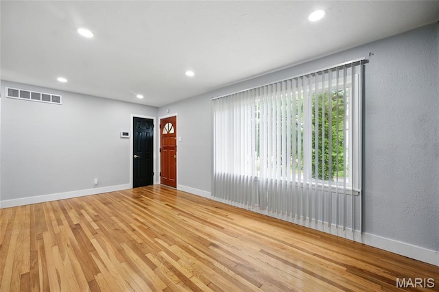 1005 Edgehill Dr, Ferguson, MO 63135 - empty room with light wood-type flooring and recessed lighting