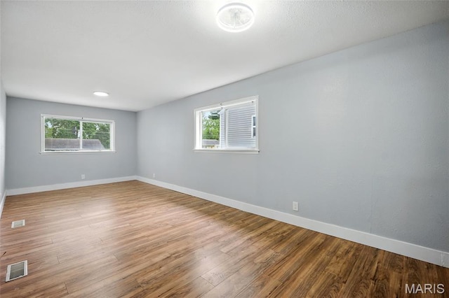 1005 Edgehill Dr, Ferguson, MO 63135 - unfurnished room with wood finished floors and baseboards