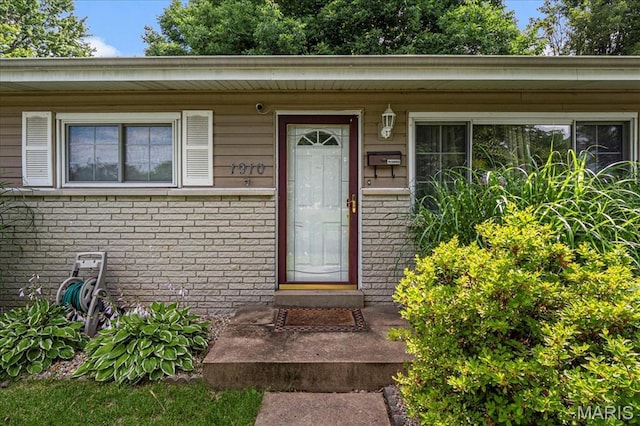 1910 Flamingo Dr, Florissant, MO 63031 - entrance to property with brick siding