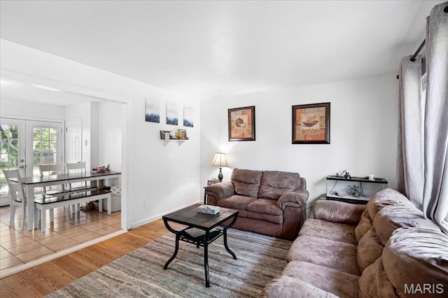 1910 Flamingo Dr, Florissant, MO 63031 - living area with wood finished floors and french doors