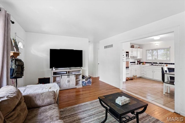 1910 Flamingo Dr, Florissant, MO 63031 - living room with light wood-type flooring