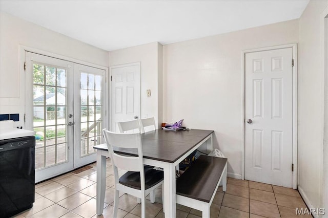 1910 Flamingo Dr, Florissant, MO 63031 - dining space featuring french doors and light tile patterned floors