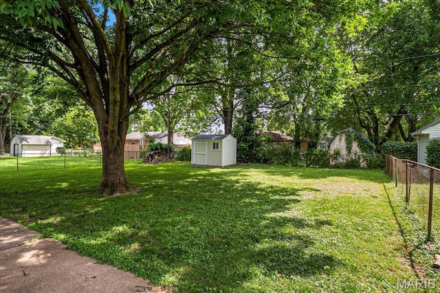 1910 Flamingo Dr, Florissant, MO 63031 - fenced backyard with a storage shed