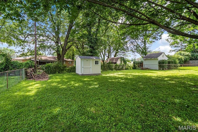 1910 Flamingo Dr, Florissant, MO 63031 - fenced backyard with a shed