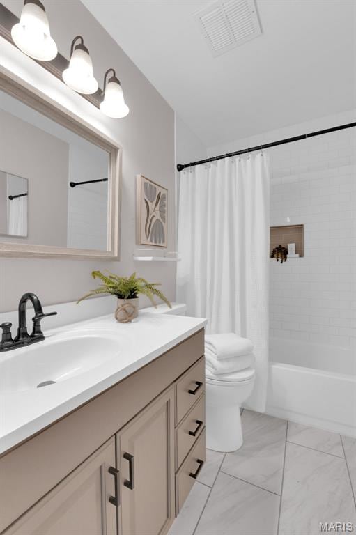 9179 N Swan Cir, Brentwood, MO 63144 - full bathroom featuring vanity, toilet, shower / tub combo, and marble look tile flooring