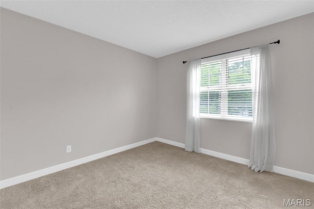 9179 N Swan Cir, Brentwood, MO 63144 - spare room featuring carpet, baseboards, and a textured ceiling