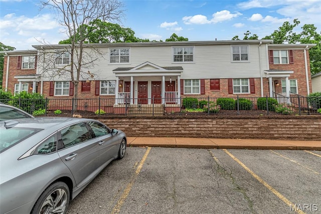 9179 N Swan Cir, Brentwood, MO 63144 - townhome / multi-family property featuring brick siding and uncovered parking