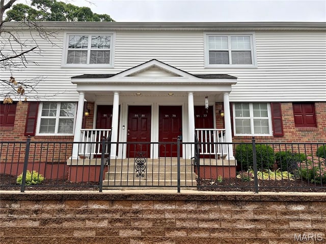 9179 N Swan Cir, Brentwood, MO 63144 - view of front of property featuring brick siding and a fenced front yard