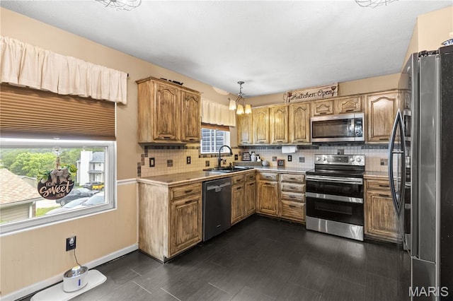 818 Sheraton Ln, Herculaneum, MO 63048 - kitchen featuring appliances with stainless steel finishes, a sink, healthy amount of natural light, and light countertops