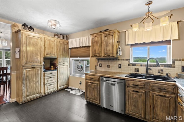 818 Sheraton Ln, Herculaneum, MO 63048 - kitchen with stainless steel dishwasher, a sink, plenty of natural light, and tasteful backsplash