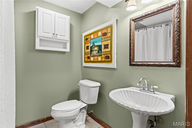 818 Sheraton Ln, Herculaneum, MO 63048 - bathroom with baseboards, tile patterned flooring, toilet, and a sink