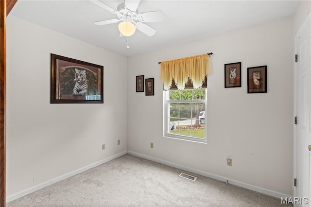 818 Sheraton Ln, Herculaneum, MO 63048 - spare room featuring carpet, baseboards, and ceiling fan