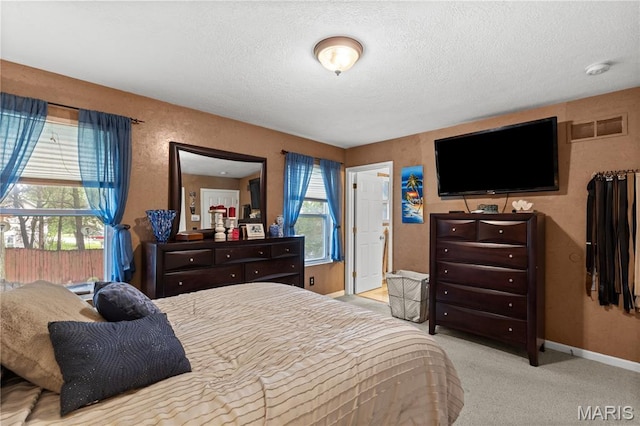 818 Sheraton Ln, Herculaneum, MO 63048 - carpeted bedroom with a textured ceiling and baseboards