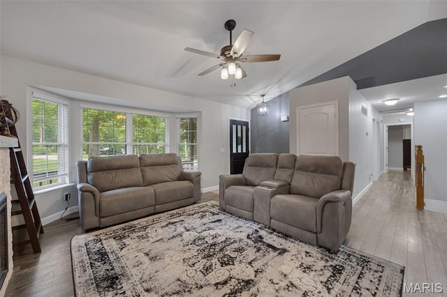 10041 Fox Haven Rd, Blackwell, MO 63626 - living area featuring a ceiling fan, baseboards, lofted ceiling, hardwood / wood-style flooring, and healthy amount of natural light