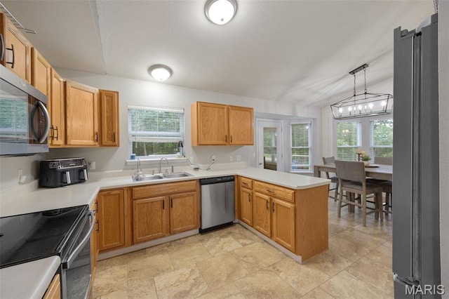 10041 Fox Haven Rd, Blackwell, MO 63626 - kitchen featuring stainless steel appliances, a sink, a peninsula, light countertops, and hanging light fixtures