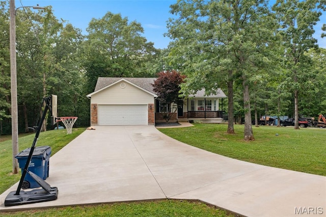 10041 Fox Haven Rd, Blackwell, MO 63626 - view of front of house with brick siding, a front yard, concrete driveway, a porch, and a garage