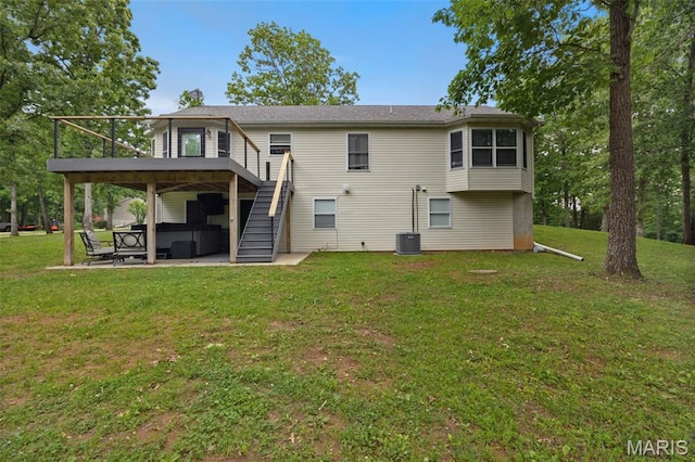 10041 Fox Haven Rd, Blackwell, MO 63626 - back of property with stairs, a patio area, a lawn, central air condition unit, and a deck