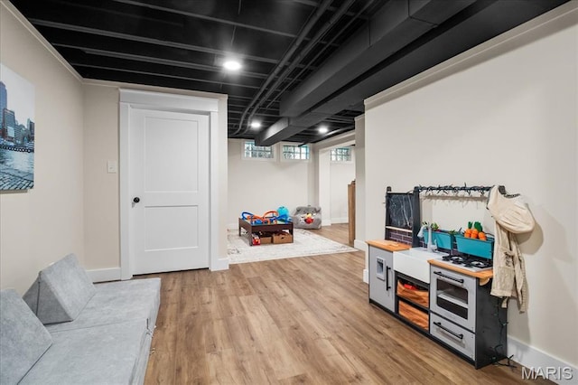 545 Autumn Bluff Dr, Ellisville, MO 63021 - below grade area with light wood-style flooring and baseboards