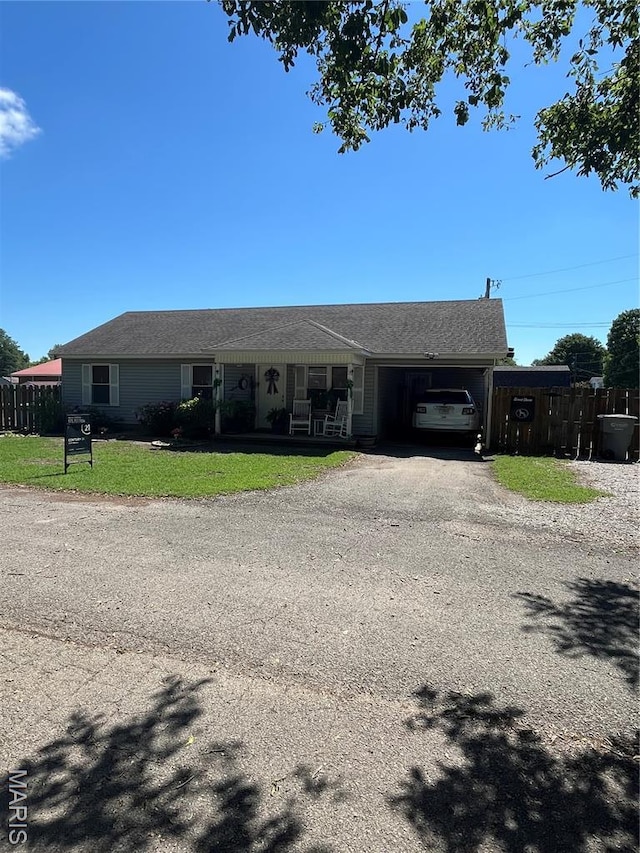 1600 Jennifer Ln, Kennett, MO 63857 - ranch-style house with a garage and gravel driveway