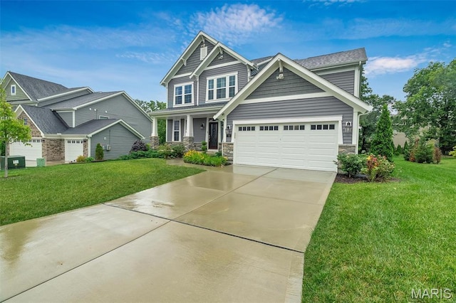 708 Kenmare Ct, Ofallon, MO 63368 - craftsman-style house with concrete driveway, a front yard, a garage, and stone siding