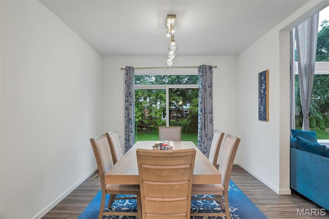 708 Kenmare Ct, Ofallon, MO 63368 - dining space featuring plenty of natural light, wood finished floors, and baseboards
