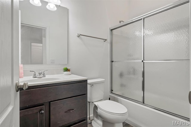 708 Kenmare Ct, Ofallon, MO 63368 - bathroom featuring vanity, toilet, and shower / bath combination with glass door