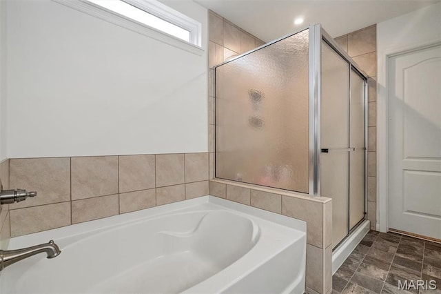 708 Kenmare Ct, Ofallon, MO 63368 - bathroom featuring a stall shower and a bath