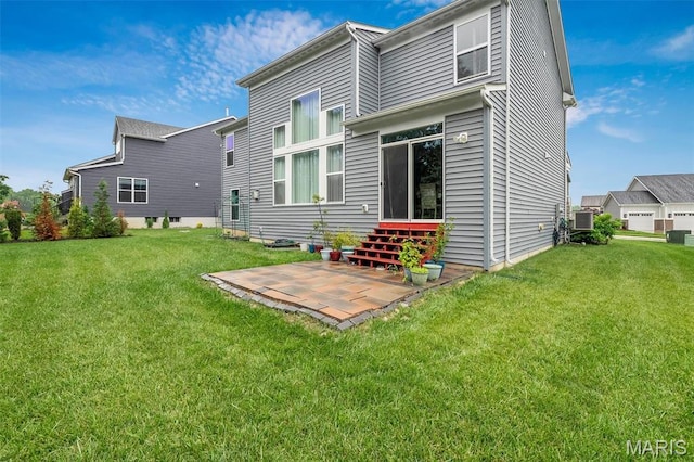 708 Kenmare Ct, Ofallon, MO 63368 - rear view of property featuring a lawn and a patio area