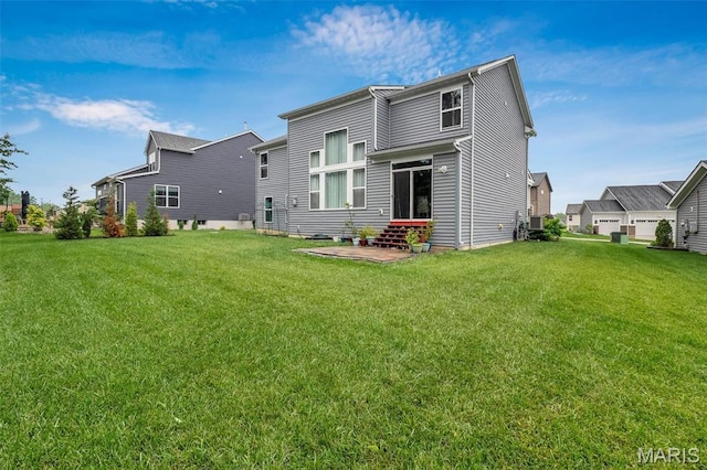 708 Kenmare Ct, Ofallon, MO 63368 - rear view of property with a yard and entry steps